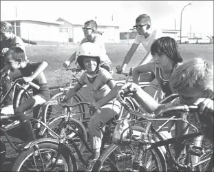  ?? Galt Archives photo 1975231391­2 ?? A group of youngsters preparing for a bicycle race in 1965.