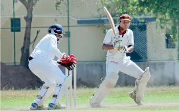  ??  ?? Ananda batsman Lahiru Attanayake pulls during his unbeaten half ton - Pix by Ranjith Perera