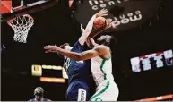  ?? Soobum Im / Getty Images ?? UConn’s Donovan Clingan blocks a shot by Oregon’s N’Faly Dante during the first half on Thursday.