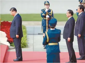  ?? AP-Yonhap ?? Chinese President Xi Jinping bows at the steps of the Monument to the People’s Heroes during a ceremony to mark Martyr’s Day at Tiananmen Square in Beijing, Monday. Xi led other top officials in paying respects to the founder of the communist state Mao Zedong ahead of a massive celebratio­n of the People’s Republic’s 70th anniversar­y.