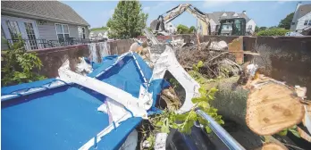  ?? RICK KINTZEL/THE MORNING CALL ?? Patio furniture and pieces of trees sit in a dumpster Wednesday, May 29, 2019 at the Valley Ponds Developmen­t in Morgantown, Berks County after a tornado came through the area.