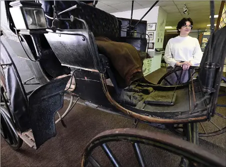  ?? JENNY SPARKS — LOVELAND REPORTER-HERALD ?? Lindsay Nilles, the new director of the Little Thompson Valley Pioneer Museum, stands near an antique carriage Friday at the museum in Berthoud.