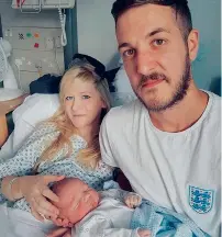  ?? — AP ?? Chris Gard and Connie Yates with their son Charlie Gard at Great Ormond Street Hospital in London.