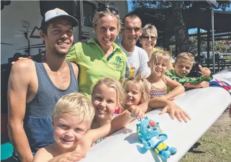  ?? Pictures: KIRSTIN PAYNE ?? (From left front) Teddy Cross, Emily, Anna and Claire Bryan and Cadel Cross and (back) Ryan, Katie, Alan and Anne Cross have helped turn the Broadwater Tourist Park, Southport, into a spectators’ village during the Games.