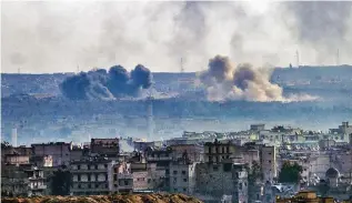  ?? – AFP ?? RAGING BATTLE: Smoke billowing from the Sheikh Said district of the government-held side of Aleppo during battle between regime forces and rebel fighters.