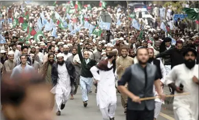  ?? PICTURE: BK BANGASH AP ?? Supporters of Pakistani religious groups march near Parliament to condemn a Supreme Court decision that acquitted Asia Bibi, a Christian woman, who spent eight years on death row accused of blasphemy, in Islamabad, Pakistan, this week.