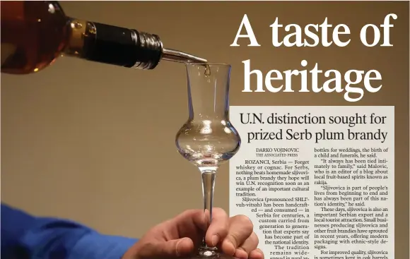  ?? (AP/Darko Vojinovic) ?? A bartender pours plum brandy into a glass Nov. 11 in Belgrade, Serbia.