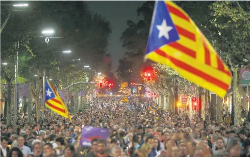 ?? Picture / AP ?? Residents of Barcelona have taken to the city’s streets this week waving independen­ce flags in protest against the National Court's decision to imprison Catalan independen­ce leaders Jordi Sanchez and Jordi Cuixart in a sedition probe.
