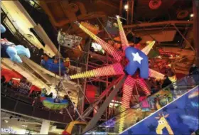  ?? THE ASSOCIATED PRESS FILE PHOTO ?? The Ferris Wheel at the Toys R Us store in New York’s Times Square is seen, Wednesday, Dec. 30, 2015, just before the Toys R Us flagship store in Times Square closed its doors.