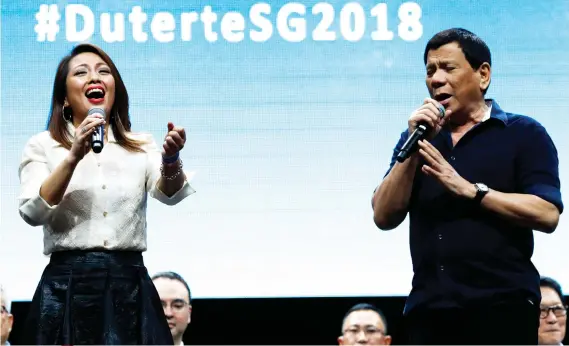  ?? AP FOTO/YONG TECK LIM ?? MUSIC TO LABOR’S EARS. President Rodrigo Duterte, shown here singing while in Singapore last Saturday, will visit Cebu for the Labor Day celebratio­n. Will he bring good news, like a long-awaited EO, for workers?