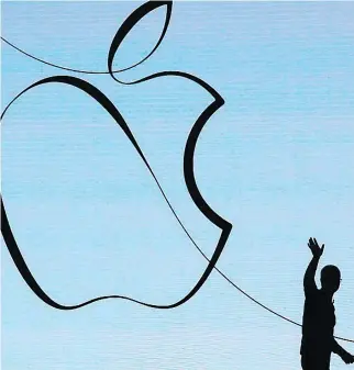  ?? JIM YOUNG/AFP-GETTY IMAGES ?? About 60 per cent of Apple’s revenue growth is forecast to be driven by services over the next five years, compared to 86 per cent of growth from iPhone sales in the previous half decade. “This is just a huge opportunit­y for us and we feel very good...
