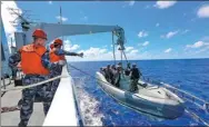  ?? ZENG TAO / XINHUA ?? A South Sea Fleet vessel prepares to release a boat with special forces personnel during a drill in the Indian Ocean. The drill included practice rescuing a hijacked ship.