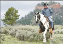  ?? SCOTT G WINTERTON/THE DESERET NEWS VIA AP (FILE) ?? Interior Secretary Ryan Zinke enjoys a horseback ride May 9 in the Bears Ears National Monument with local and state representa­tives in Blanding, Utah.