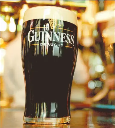  ?? PETER MACDIARMID / REUTERS ?? Diageo PLC, makers of Guinness, plans to unveil 10 new versions of the dark ale James Joyce once praised as “the frothy freshener.” The company is aiming the less-bitter blends at occasional Guinness drinkers.