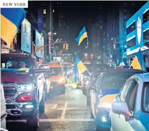  ?? ?? NEW YORK
Clockwise from above: a motorcade supporting Ukraine in New York; a Russian who is married to a Ukrainian cries during a rally in Athens; a demonstrat­ion at Rathenaupl­atz square in Frankfurt; protesters in Vilnius, Lithuania