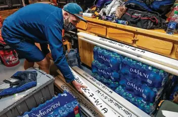  ?? Photos by Mark Mulligan / Staff photograph­er ?? Chris Lowery uses metal tubes to scour the Gulf of Mexico floor for samples of sediment that could point to sand useful for restoratio­n along the Texas coast. Climate change and stronger storms have caused erosion.