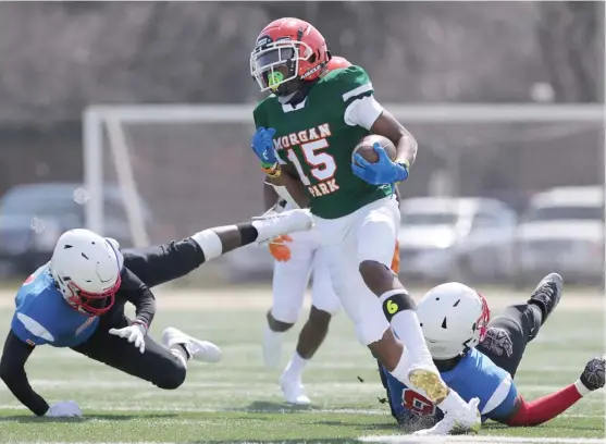  ?? ALLEN CUNNINGHAM/SUN-TIMES ?? Tysean Griffin, who played defensive back and slot receiver this spring as a freshman, returns a kick against Curie. He already has five scholarshi­p offers.