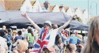  ?? ?? A reveller in party mood at the the Lee-on-the-Solent beacon event Picture: Sarah Standing (020622-6198)