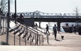  ??  ?? People walk along the Mississipp­i River at Tom Lee Park on a warm Sunday afternoon Feb. 3, 2019. JOE RONDONE/THE COMMERCIAL APPEAL