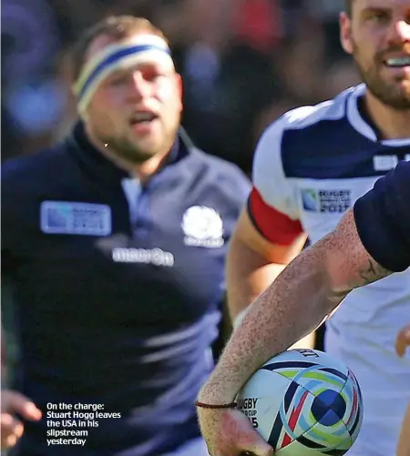  ??  ?? On the charge: Stuart Hogg leaves the USA in his slipstream yesterday