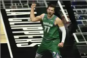  ?? KYUSUNG GONG — THE ASSOCIATED PRESS ?? Dallas Mavericks guard Luka Doncic celebrates after scoring and drawing a foul during the first half against the Los Angeles Clippers in Los Angeles on Sunday.