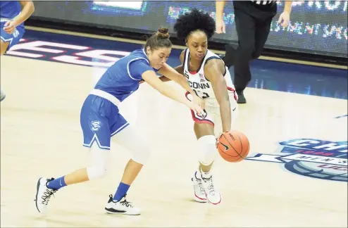  ?? David Butler II / USA Today ?? UConn’s Christyn Williams (13) steals the ball from Creighton’s guard Tatum Rembao (2) in Thursday’s game in Storrs.