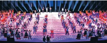  ??  ?? Participan­ts in full costume belt out a number during the Southeast Asian Games opening ceremony dress and technical rehearsals Tuesday at the Philippine Arena in Bocaue, Bulacan. (Rio Deluvio)