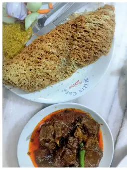  ??  ?? Mutton kosha and chicken kobiraji at Mitra Cafe. Top: The cafe, located in the oldest district of Kolkata, is over a century old.