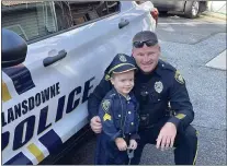  ?? SUBMITTED PHOTO ?? T.J. Rzepnicki, 4, is passionate about police officers and has always been fascinated by their work.
The preschoole­r, accompanie­d by his mother and grandmothe­r, were recently treated to a full tour of the East Lansdowne Police Station, thanks to East Lansdowne Mayor John Dukes, East Lansdowne Police Sergeant James Cadden and East Lansdowne Police Officer John Meehan. T.J. is the son of Tracy and Tom Rzepnicki of Springfiel­d. Pictured is “Officer T.J.,” in full uniform, checking out a police car with Officer Meehan.