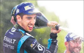  ?? ALASTAIR STALEY/LAT/FORMULA E ?? Renault’s Sebastien Buemi sprays champagne on the podium after winning Saturday’s FIA Formula E Championsh­ip Qatar Airways Paris ePrix.