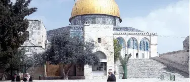  ?? Associated Press ?? ↑
A Palestinia­n walks in front of the Dome of the Rock in Jerusalem on Sunday.