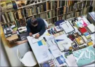  ?? PAUL BARBERA VIA AP ?? This undated photo provided by Paul Barbera shows Tadao Ando in Osaka, Japan, at his desk working. The photo is featured in the book “Where They Create,” which explores people and their creative studios.