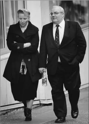  ?? Nick Pro caylo, PNG, Postmedia News ?? Polygamist leader Winston Blackmore, right, arrives Wednesday at federal tax court in Vancouver with one of his wives, Marjorie Johnson.