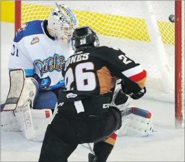  ?? Ed Kaiser/edmonton Journal ?? Edmonton Oil Kings goalie Laurent Brossoit is fresh off a Battle of Alberta series against the Calgary Hitmen. Above, Zane Jones scores the winner on Friday night — a 5-2 Calgary win — but Brossoit, who will be at Team Canada’s world junior selection...