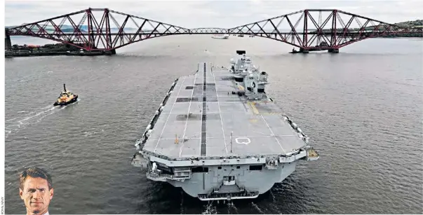  ??  ?? HMS Queen Elizabeth approaches the Forth Bridge ready for its passage to Portsmouth. The decision to allow Commodore Nick Cooke-priest, left, to sail the aircraft carrier was reversed