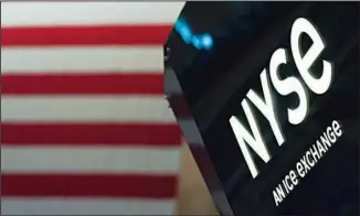  ?? ?? An NYSE sign is seen on the floor at the New York Stock Exchange in New York, on June 15, 2022. Stocks are opening lower on Wall Street on Aug 9, led by a steep drop for Norwegian Cruise Line. (AP)