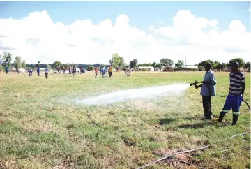  ?? ?? Groundsman working on the new turf at Murambinda B High School Stadium recently