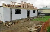  ?? MALCOLM DEVERSON ?? The Black Sheep Boutique building under constructi­on in Owaka.