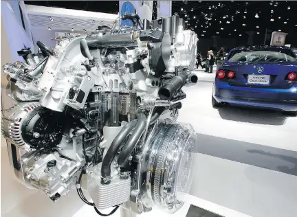  ?? DAMIAN DOVARGANES/THE ASSOCIATED PRESS FILES ?? A Volkswagen Jetta TDI diesel engine is displayed at the 2008 Los Angeles Auto Show. Volkswagen Group Canada has agreed to give cash payouts to drivers affected by the automaker’s diesel emissions-rigging ploy uncovered in September 2015.