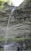  ?? JOHN McKNIGHT/THE ASSOCIATED PRESS ?? A visitor stands atop Kaaterskil­l Falls, looking toward the Catskill Mountains, which offer dozens of trails through pretty woods that lead to great views.