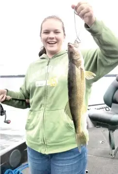  ?? | DALE BOWMAN/ FOR THE SUN- TIMES ?? Sara Bowman enjoyed catching walleye in the Minocqua area of Wisconsin with help from guide Kurt Justice.