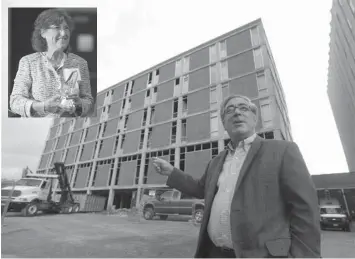  ?? ASSOCIATED PRESS ?? Developer Larry Glazer gestures toward a building to be demolished on Alexander Street in Rochester, New York. Inset is his Jane.