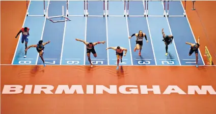  ??  ?? Winning feeling: Andrew Pozzi (lane four) gets over the line first in the 60m hurdes, before showing off his gold medal (left)