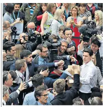  ??  ?? Copies of Labour’s manifesto are handed to journalist­s yesterday. Below, Jeremy Corbyn and John Mcdonnell