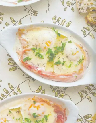  ?? TOUCHWOOD EDITIONS ?? French Baked Eggs with White Truffle Cream, featured in First, We Brunch by Rebecca Wellman, is served at Tonolli’s Deli in Central Saanich.