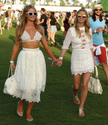  ?? MATT COWAN/GETTY IMAGES FOR COACHELLA ?? The presence of Paris Hilton, left, and Nicky Hilton at Coachella has, in a way, disrupted the entire fashion order.
