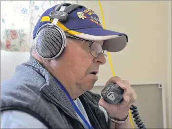  ?? LAWRENCE POWELL ?? Brian Deathe of the Greenwood Amateur Radio Club talks to a fellow ‘Ham’ in New Hampshire. He was at the Wilmot community hall June 23 taking part in the American Radio Relay Leaque’s annual field day. The event helps amateur radio operators keep up and improve their skills that are often called upon by other agencies in times of trouble.