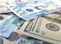  ?? BW FILE PHOTO ?? THE PESO barely moved versus the dollar on Tuesday as investors waited for the US central bank’s latest policy decision.