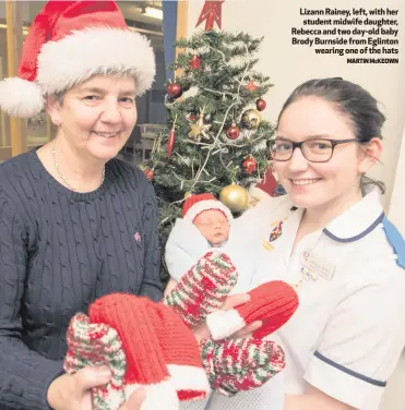  ?? MARTIN McKEOWN ?? Lizann Rainey, left, with her student midwife daughter, Rebecca and two day-old baby Brody Burnside from Eglinton
wearing one of the hats