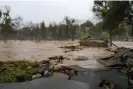  ?? Photograph: Anadolu Agency/Getty Images ?? A road was washed away during heavy rain in Springvill­e, California.